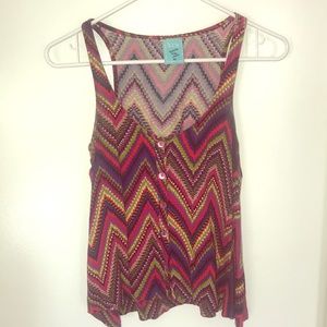Dimensional, bright crop tank perfect for Summer!